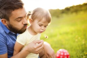 Dad and Child in the Backyard Celebrating Father's Day