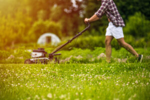 man mowing lawn in the Fall