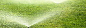 Sprinkler system on a lush green lawn